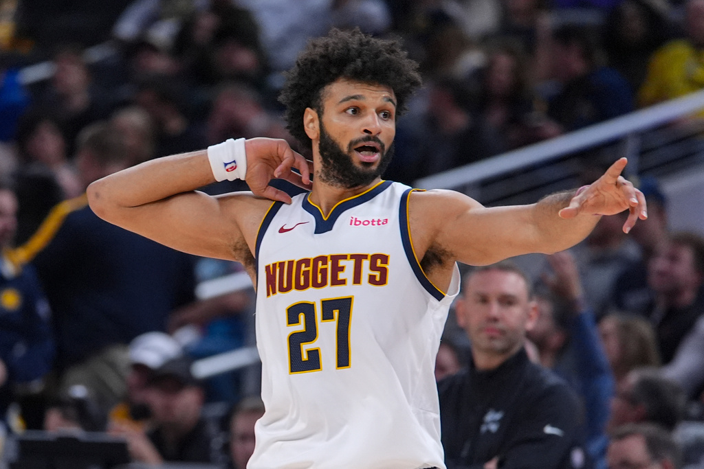 Denver Nuggets guard Jamal Murray (27) reacts after scoring his 50th point against the Indiana Pacers during the second half of an NBA basketball game in Indianapolis, Wednesday, Dec. 3, 2025. (AP Photo/Michael Conroy)