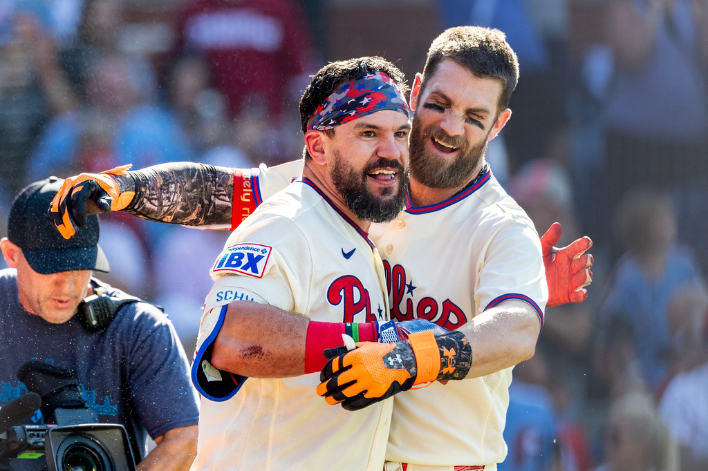Philadelphia Phillies' Kyle Schwarber, left, and Bryce Harper celebrate after Schwarber hit the game winning home run in the ninth inning of a baseball game against the St. Louis Cardinals, Sunday, Aug. 23, 2026, in Philadelphia. (AP Photo/Laurence Kesterson)