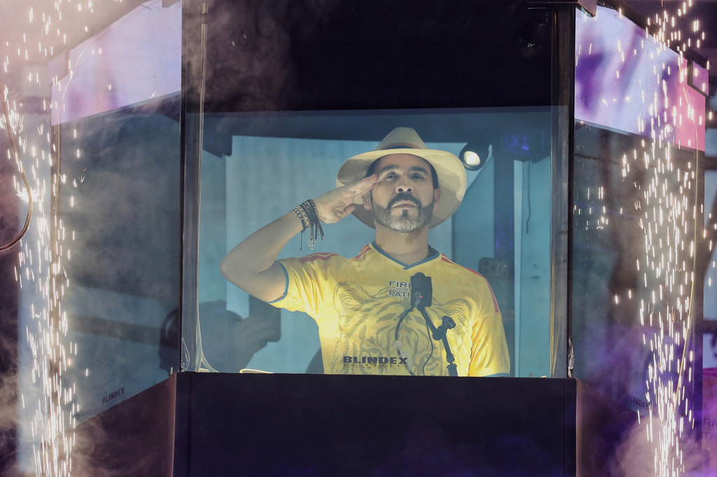 FILE - Presidential candidate Abelardo de la Espriella stands before supporters from inside a bulletproof booth during his campaign rally in Buga, Colombia, June 14, 2026. (AP Photo/Santiago Saldarriaga, File)