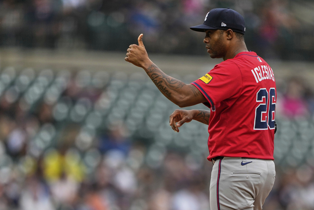 Atlanta Braves relief pitcher Raisel Iglesias gestures during the ninth inning of a baseball game against the Detroit Tigers, Sunday, Sept. 21, 2025, in Detroit. (AP Photo/Ryan Sun)