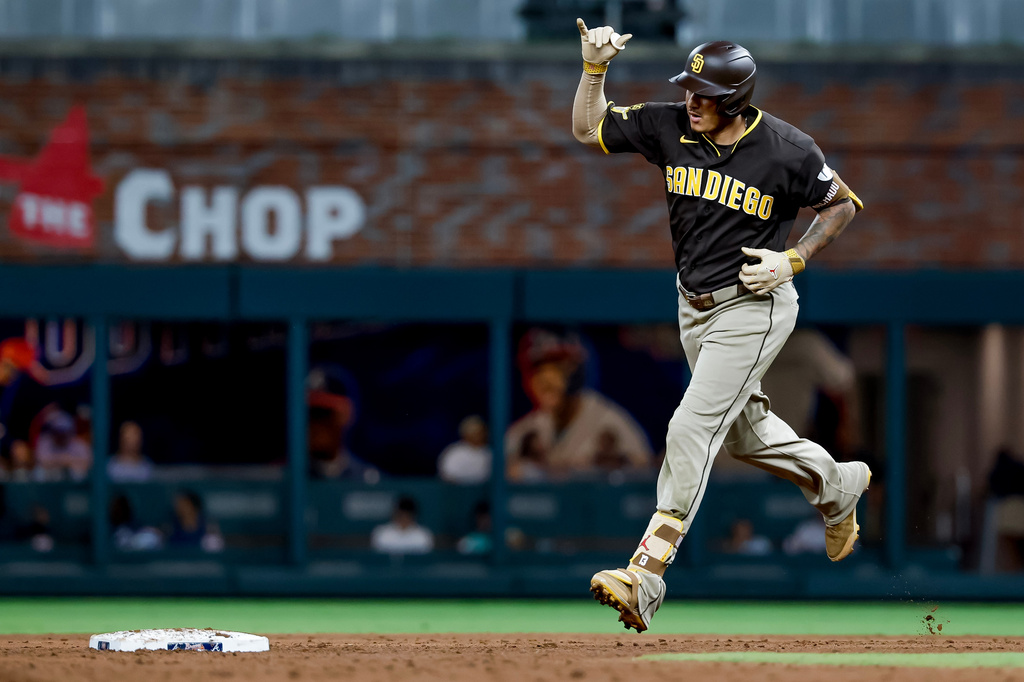 San Diego Padres' Manny Machado reacts while rounding the bases after hitting a solo home run against the Atlanta Braves during the sixth inning of a baseball game, Tuesday, July 21, 2026, in Atlanta. (AP Photo/Erik S. Lesser)
