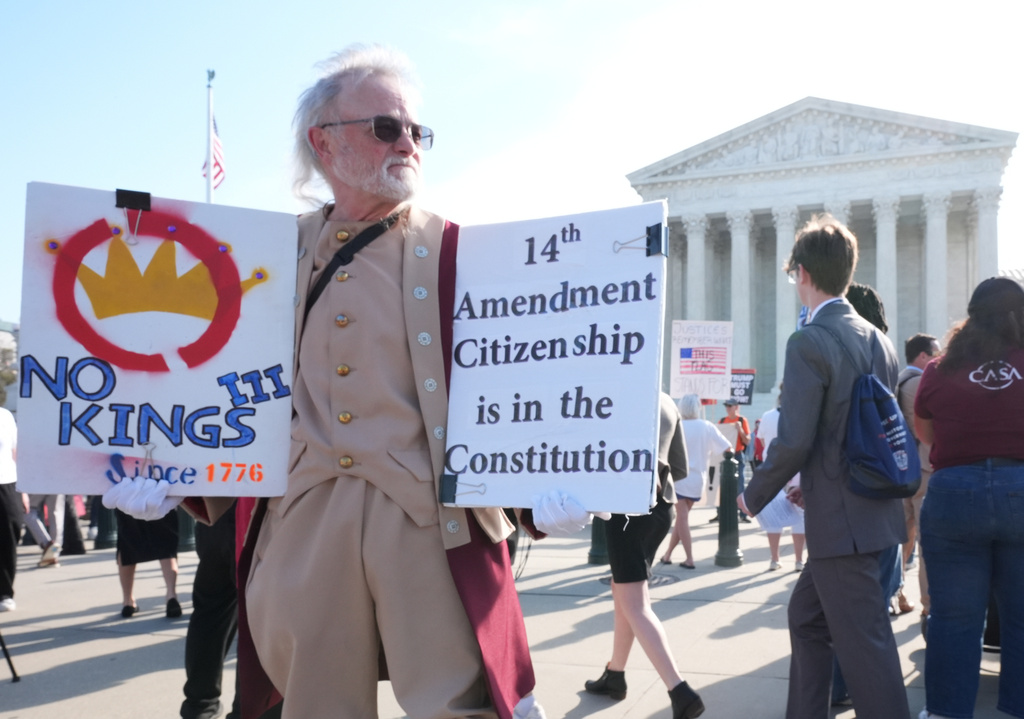 Pro and anti-Trump demonstrators rally outside the U.S. Supreme Court, before justices hear oral arguments on whether President Donald Trump can deny citizenship to children born to parents who are in the United States illegally or temporarily, on Capitol Hill, in Washington, Wednesday, April 1, 2026. (AP Photo/J. Scott Applewhite)