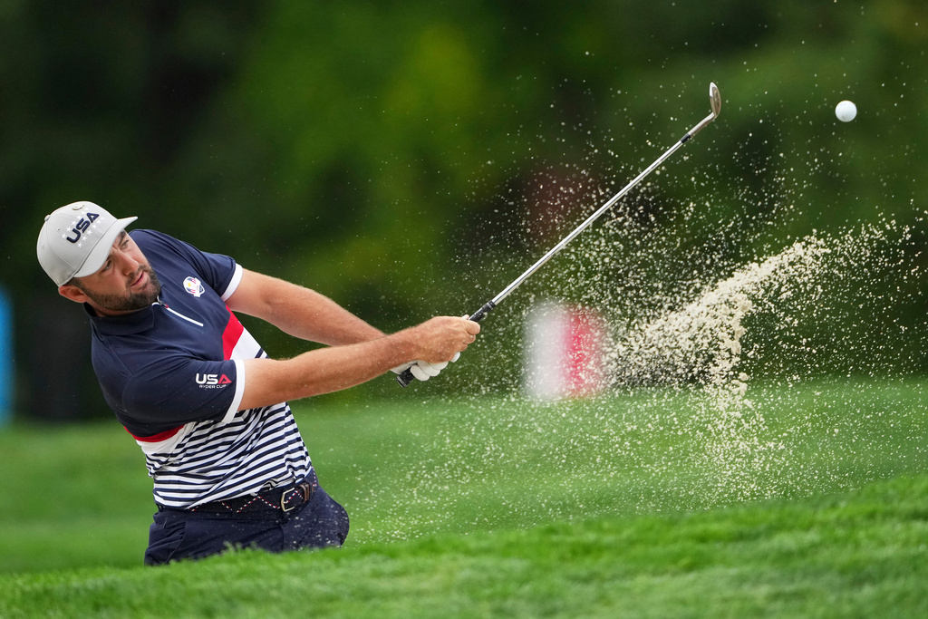 United States' Scottie Scheffler hits from the bunker on the fourth hole at Bethpage Black golf course during the Ryder Cup golf tournament, Friday, Sept. 26, 2025, in Farmingdale, N.Y. (AP Photo/Lindsey Wasson)