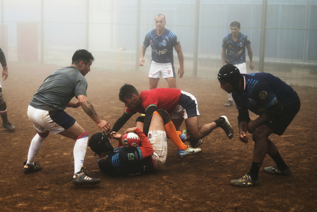 Inmates play rugby at the Valparaiso Prison Complex in Valparaiso, Chile, as part of a social reintegration program, Thursday, Jan. 29, 2026. (AP Photo/Cristobal Escobar)