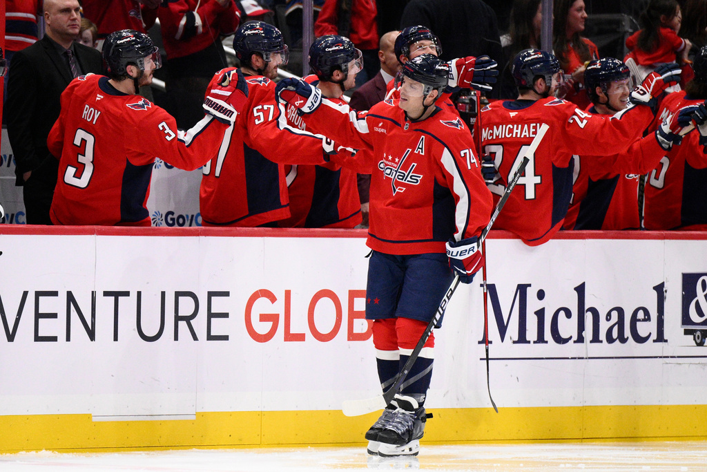 Washington Capitals defenseman John Carlson (74) celebrates his goal during the second period of an NHL hockey game against the New York Rangers, Tuesday, Dec. 23, 2025, in Washington. (AP Photo/Nick Wass)