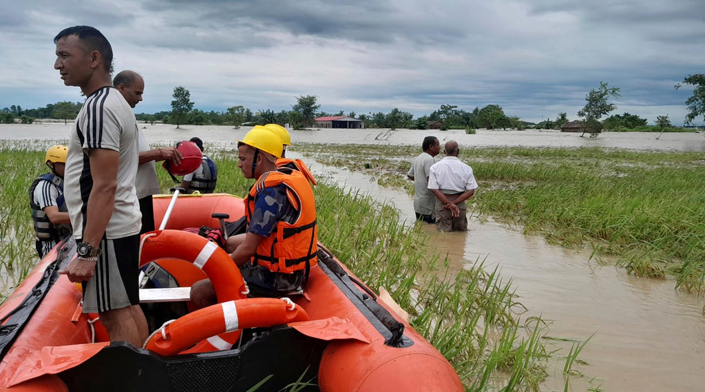 Nepalese army personnel get ready to rescue survivors after a flood in Jhapa district east of Nepal, Sunday, Oct. 5, 2025. (Nepal Army via AP)