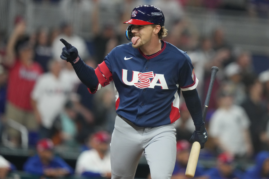 United States' Gunnar Henderson gestures to his teammates after hitting a home run during the fourth inning of a World Baseball Classic semifinal game against the Dominican Republic, Sunday, March 15, 2026, in Miami. (AP Photo/Lynne Sladky)