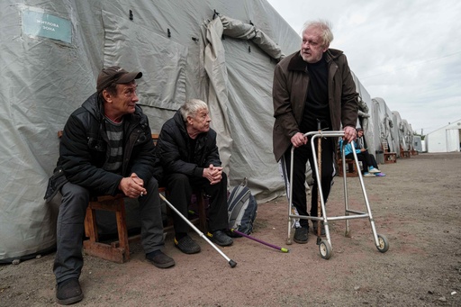 Men rest and talk at a center for displaced persons, after they evacuated from settlements on the frontline, in Pavlohrad, Ukraine, Wednesday, Oct. 8, 2025. (AP Photo/Evgeniy Maloletka) Men rest and talk at a center for displaced persons, after they evacuated from settlements on the frontline, in Pavlohrad, Ukraine, Wednesday, Oct. 8, 2025. (AP Photo/Evgeniy Maloletka)