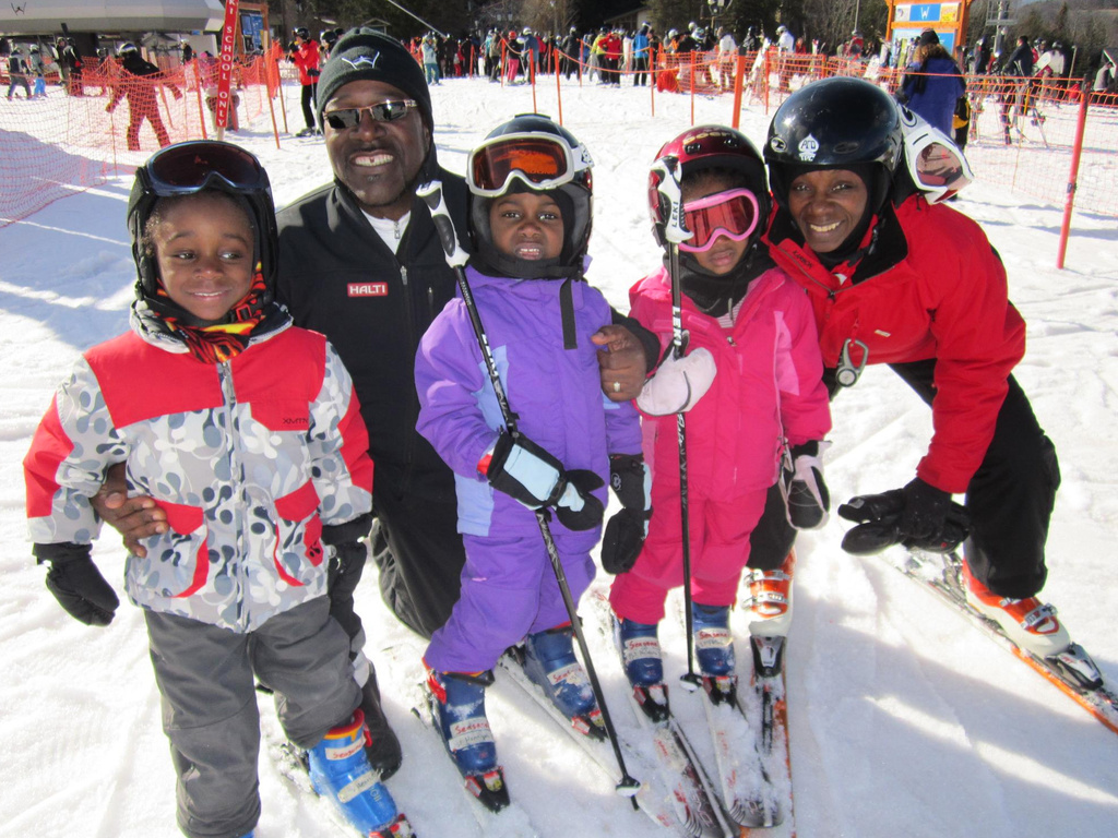 in this undated handout photo provided by Karen Rivers, dad Henri Rivers and mom Karen Rivers, pose with children Henniyah, Henri IV, and Helaina in Windham Mountain, NY. (Karen Rivers via AP)