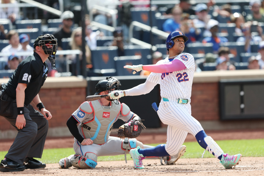 New York Mets' Juan Soto (22) watches his grand slam during the sixth inning of a baseball game against the Miami Marlins, Sunday, May 31, 2026, in New York. (AP Photo/Heather Khalifa)