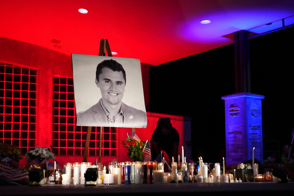 FILE - A photo of Charlie Kirk, the CEO and co-founder of Turning Point USA, stands at his vigil on Sept. 11, 2025, in Orem, Utah. (AP Photo/Lindsey Wasson, File)