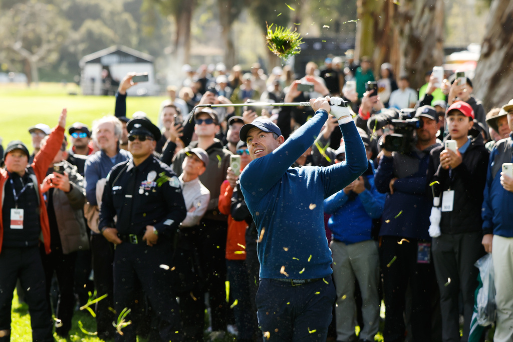 Rory McIlroy, from Northern Ireland, hits from a fairway rough on the eighth hole during the first round of the Genesis Invitational golf tournament at Riviera Country Club, Thursday, Feb. 19, 2026, in the Pacific Palisades area of Los Angeles. (AP Photo/Caroline Brehman)