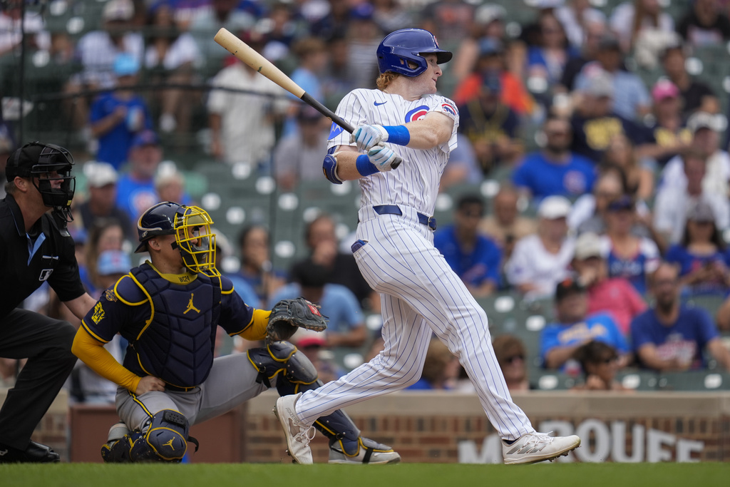 Chicago Cubs' Owen Caissie (19) hits his first major league career home run during the sixth inning in the first baseball game of a doubleheader against the Milwaukee Brewers, Tuesday, Aug. 19, 2025, in Chicago. (AP Photo/Erin Hooley)
