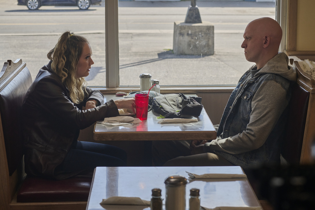This image released by Republic Pictures shows Billie Lourd, left, and Anthony Carrigan in a scene from "Adulthood." (Albert Camicioli/Republic Pictures via AP)