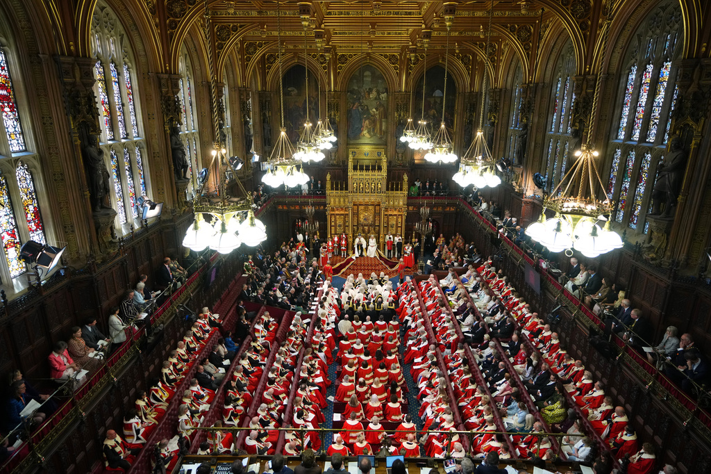 Britain's King Charles III sits besides Queen Camilla during the State Opening of Parliament at the Palace of Westminster in London, Wednesday, May 13, 2026.(AP Photo/Kirsty Wigglesworth, Pool)