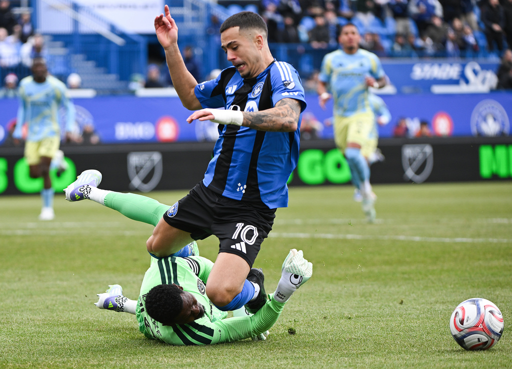 Philadelphia Union goalkeeper Andre Blake stops CF Montreal's Ivan Jaime (10) during the first half of an MLS soccer game in Montreal, Saturday, April 11, 2026. (Graham Hughes/The Canadian Press via AP)