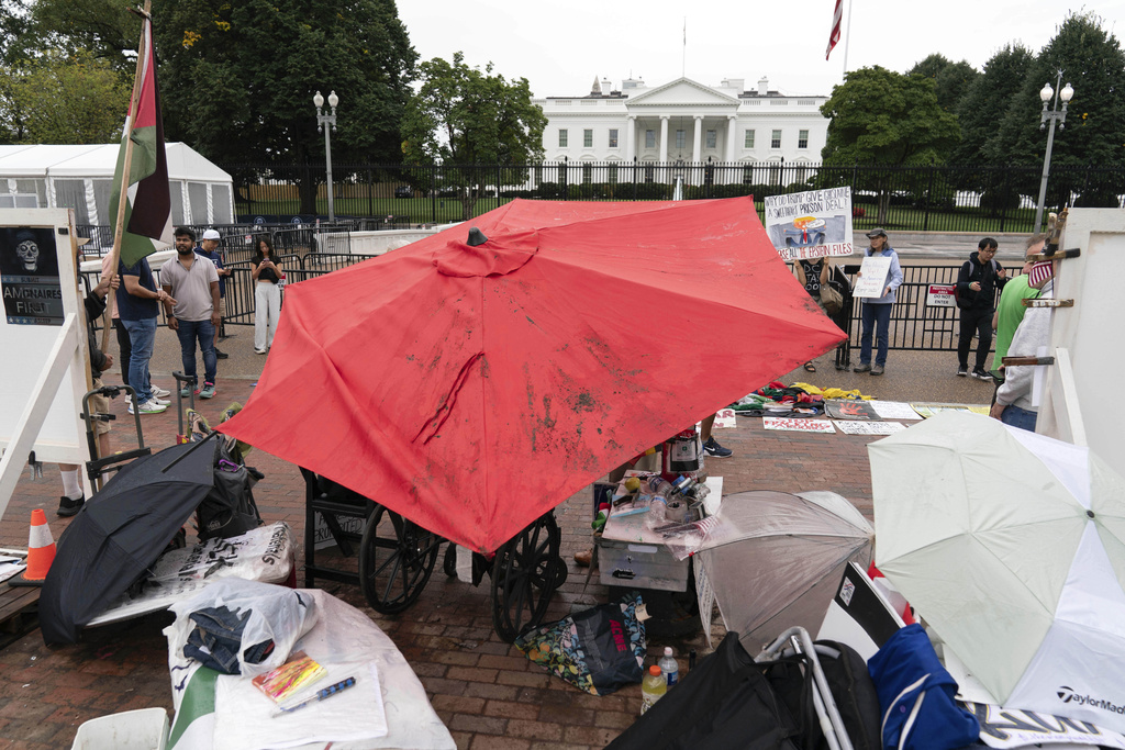 Demonstrators are seen during a Peace Vigil in Lafayette Park across from the White House in Washington, Sunday, Sept. 7, 2025. (AP Photo/Jose Luis Magana)