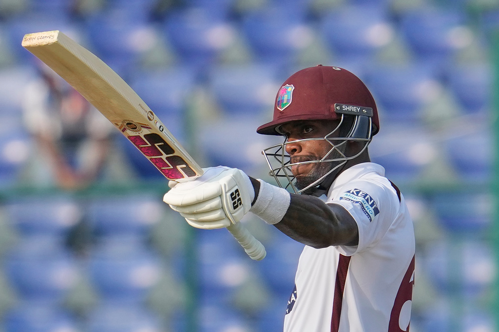 FILE - West Indies' Justin Greaves celebrates after scoring fifty runs on the fourth day of the second cricket test match between India and West Indies at the Arun Jaitley Stadium in New Delhi, India, Oct. 13, 2025. (AP Photo/Manish Swarup, File)
