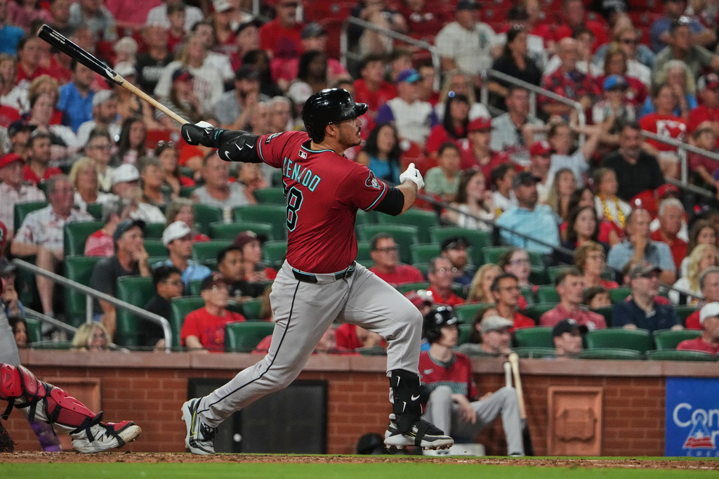 Arizona Diamondbacks' Nolan Arenado watches his RBI double during the ninth inning of a baseball game against the St. Louis Cardinals Tuesday, June 23, 2026, in St. Louis. (AP Photo/Jeff Roberson)