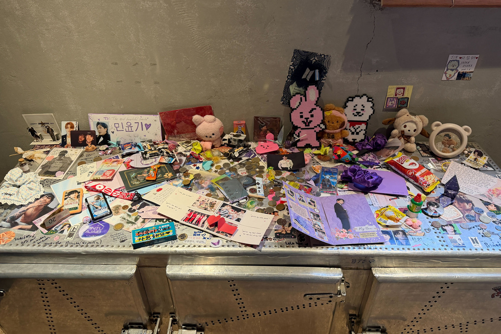 Letters, photographs, and trinkets from around the world, are displayed at Cafe HYUGA, a former trainee dormitory for K-pop band BTS, now converted into a cafe, in Seoul, South Korea, Friday, March 20, 2026. (AP Photo/Juwon Park)