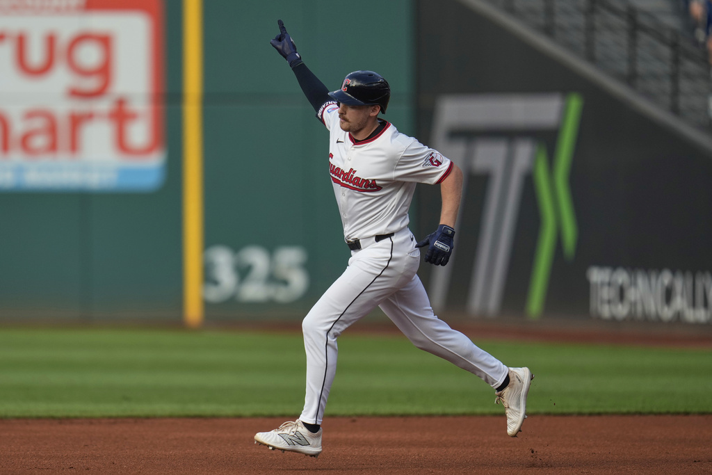 Cleveland Guardians' Kyle Manzardo (9) gestures as he runs the bases with a home run in the first inning of a baseball game against the Miami Marlins in Cleveland, Tuesday, Aug. 12, 2025. (AP Photo/Sue Ogrocki)