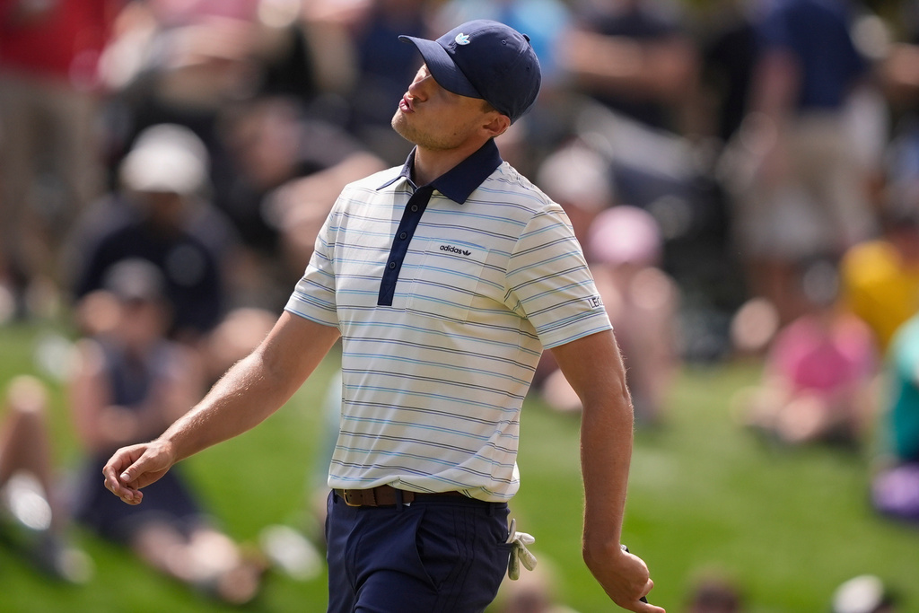 Ludvig Aberg of Sweden, reacts to a missed putt on the third green during the final round of The Players Championship golf tournament, Sunday, March 15, 2026, in Ponte Vedra Beach, Fla. (AP Photo/Gerald Herbert)