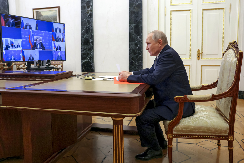 Russian President Vladimir Putin chairs a meeting with members of the Security Council via videoconference at the Kremlin in Moscow, Russia, Friday, March 13, 2026. (Gavriil Grigorov, Sputnik, Kremlin Pool Photo via AP)