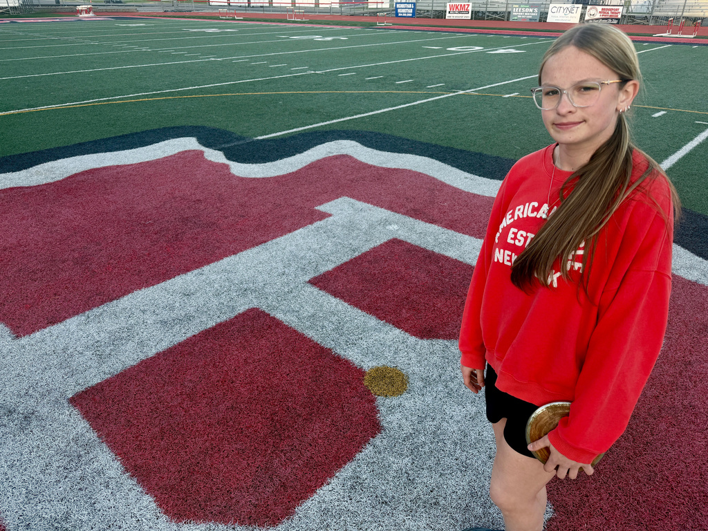 Becky Pepper-Jackson poses on the infield Tuesday, April 7, 2026, at Bridgeport High School in Bridgeport, W.VA. (AP Photo/John Raby)
