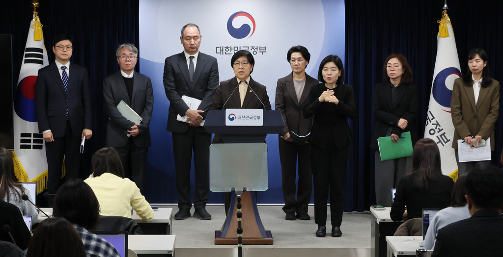 South Korean Health Minister Jeong Eun Kyeong, center, speaks during a briefing at the government complex in Seoul, South Korea, Tuesday, Feb. 10, 2026. (Lee Jung-hoon/Yonhap via AP)