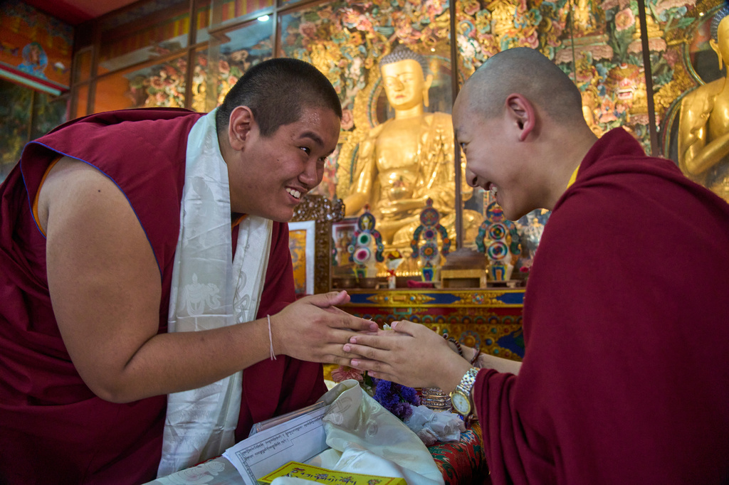 Jalue Dorje greets his friend and fellow monk, Trulshik Yangsi Rinpoche, during a ritual at Shechen Monastery in Kathmandu, Nepal, Tuesday, April 7, 2026. (AP Photo/Niranjan Shrestha)