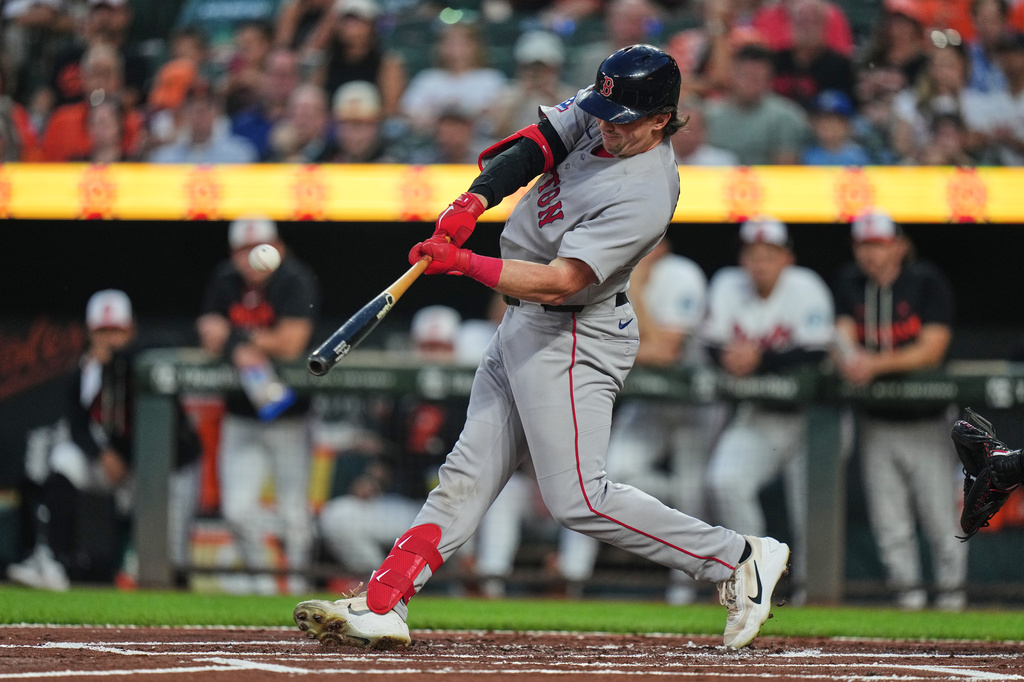 Boston Red Sox' Adley Rutschman hits a home run during the first inning of a baseball game against the Baltimore Orioles, Thursday, Sept. 3, 2026, in Baltimore. (AP Photo/Stephanie Scarbrough)