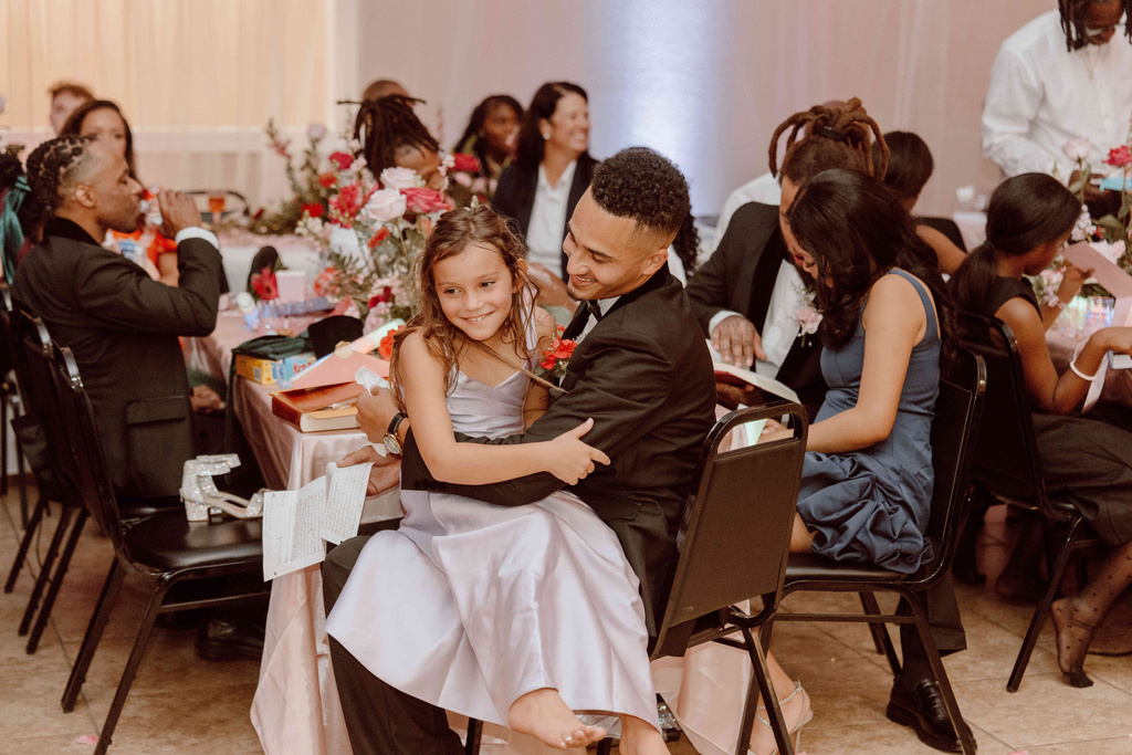 This photo provided by God Behind Bars shows prisoners at the Louisiana State Penitentiary during a father-daughter dance held inside the lockup in Angola, La., on Saturday, Nov. 22, 2025. (God Behind Bars via AP)