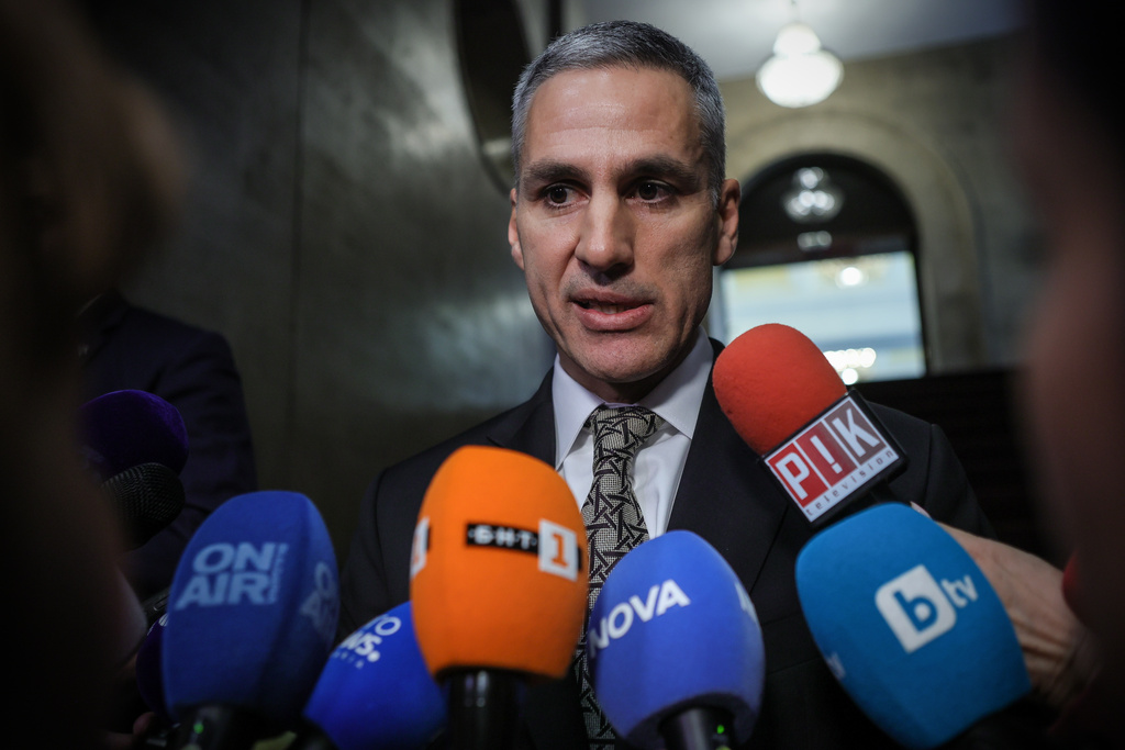 Andrey Gyurov, the prime minister–designate, speaks to journalists after presenting the list of his caretaker government at Bulgarian presidency office in Sofia, Bulgaria, Wednesday, Feb. 18, 2026. (AP Photo/Valentina Petrova)