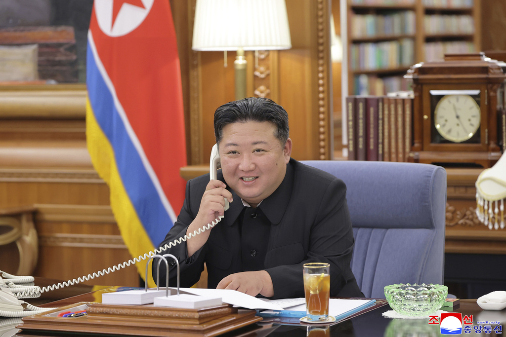 In this photo provided by the North Korean government, its leader Kim Jong Un speaks with Russian President Vladimir Putin on the phone at an undisclosed location in North Korea, Tuesday, Aug. 12, 2025. Independent journalists were not given access to cover the event depicted in this image distributed by the North Korean government. The content of this image is as provided and cannot be independently verified. Korean language watermark on image as provided by source reads: "KCNA" which is the abbreviation for Korean Central News Agency. (Korean Central News Agency/Korea News Service via AP)