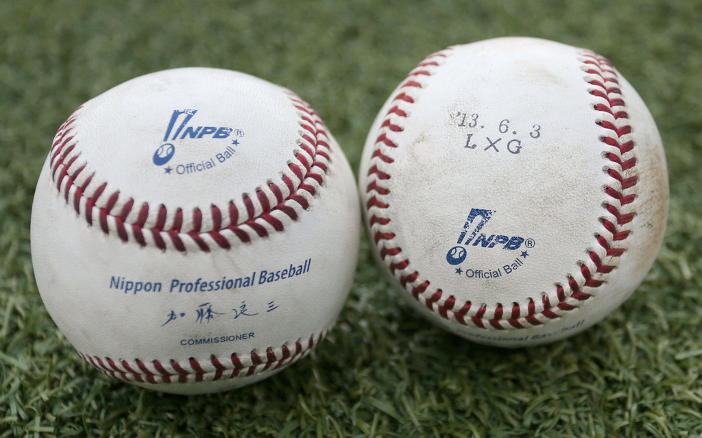 FILE -In this photo taken June 12, 2013, two baseballs, used in the June 3, 2013 game between the Seibu Lions and the Yomiuri Giants, are pictured at Seibu Dome indoor baseball stadium in Tokorozawa, Japan. (AP Photo/Kyodo News, File) JAPAN OUT, MANDATORY CREDIT,