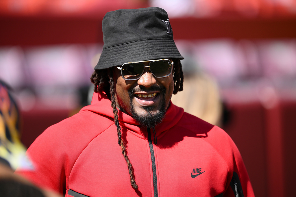 FILE - Marshawn Lynch looks on before an NFL preseason football game between the Washington Commanders and the Baltimore Ravens, Aug. 23, 2025, in Landover, Md. (AP Photo/Nick Wass, File)