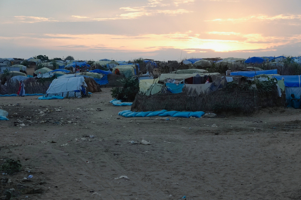 FILE - The sun sets on a refugee camp set up people fleeing war in Sudan, Oct. 3, 2024, in Adre, Chad. (AP Photo/Sam Mednick)
