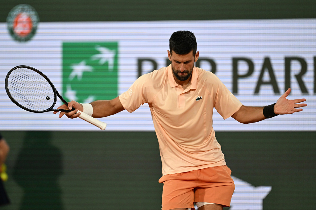 Novak Djokovic of Serbia celebrates after winning the first round men's singles tennis match against against Giovanni Mpetshi Perricard of France at the French Open tennis tournament in Paris, Sunday, May 24, 2026. (AP Photo/Emma Da Silva)