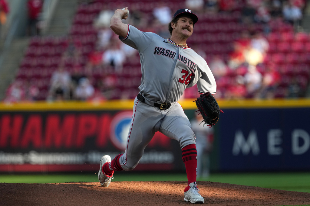 Washington Nationals pitcher Miles Mikolas delivers a pitch during the first inning of a baseball game against the Cincinnati Reds, Tuesday, May 12, 2026, in Cincinnati. (AP Photo/Kareem Elgazzar)