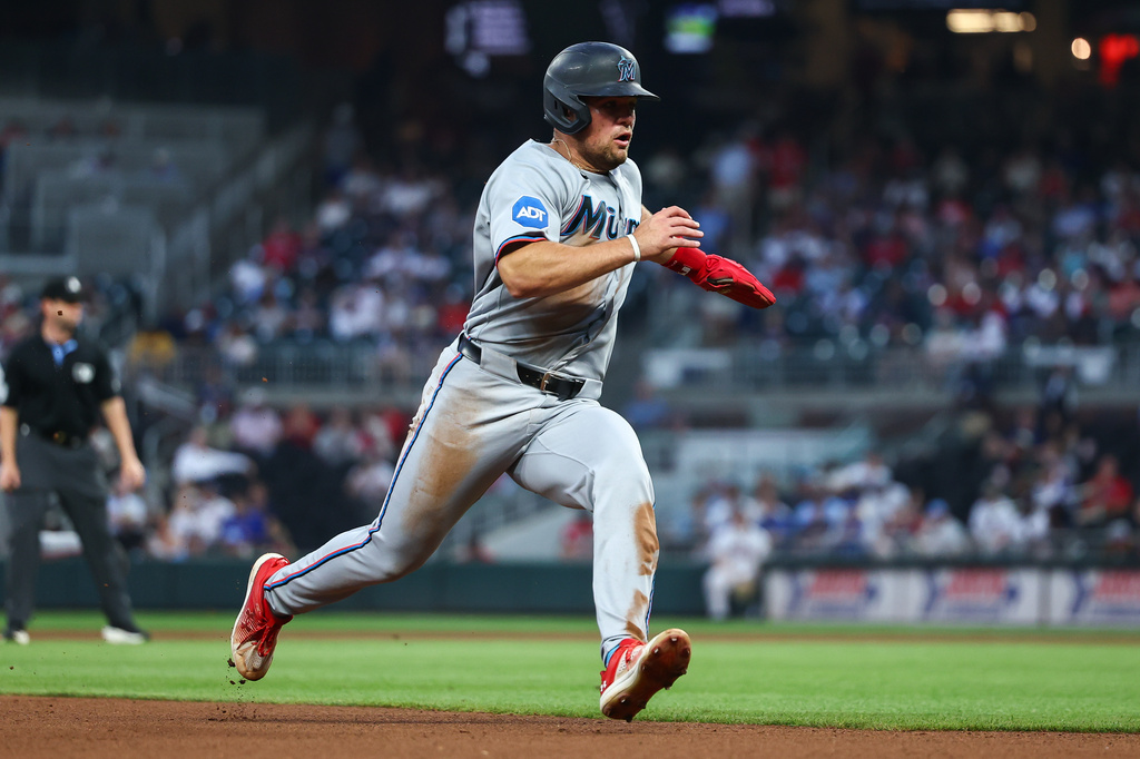 Miami Marlins' Jakob Marsee runs to third base in the fourth inning of a baseball game against the Atlanta Braves, Monday, April 13, 2026, in Atlanta. (AP Photo/Colin Hubbard)