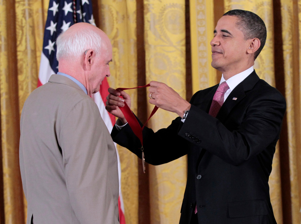 FILE - President Barack Obama presents a National Humanities Medal to poet, novelist, farmer and conservationist, Wendell E. Berry, March 2, 2011, during a ceremony in the East Room of the White House in Washington. (AP Photo/Pablo Martinez Monsivais, File)