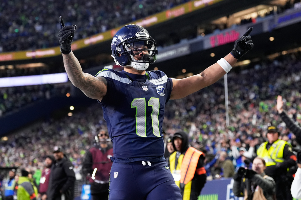 Seattle Seahawks wide receiver Jaxon Smith-Njigba (11) celebrates his touchdown catch during the first half of the NFC Championship NFL football game against the Los Angeles Rams, Sunday, Jan. 25, 2026, in Seattle. (AP Photo/Godofredo A. Vásquez)