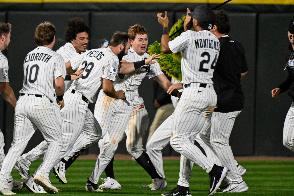 Chicago White Sox's Sam Antonacci, center, celebrates with teammates after he hit a two-run single during the ninth inning of a baseball game against the Cleveland Guardians, Monday, June 22, 2026, in Chicago. (AP Photo/Matt Marton)