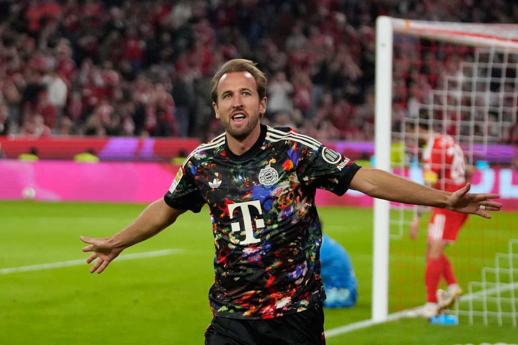 Bayern's Harry Kane celebrates after scoring his side's fourth goal during the Bundesliga soccer match between Bayern Munich and 1. FC Union Berlin in Munich, Germany, Friday, Sept. 18, 2026. (AP Photo/Matthias Schrader)