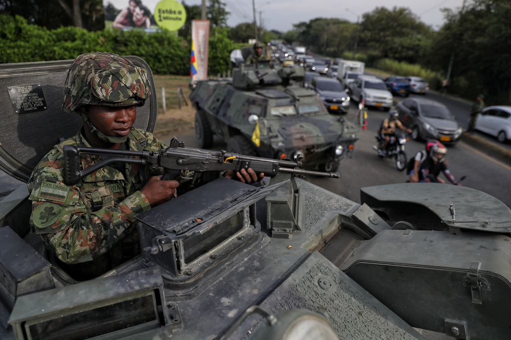 A soldier keeps watch from the turret of an armored vehicle ahead of the inauguration of President-elect Abelardo de la Espriella in Cali, Colombia, Wednesday, Aug. 5, 2026. (AP Photo/Santiago Saldarriaga)