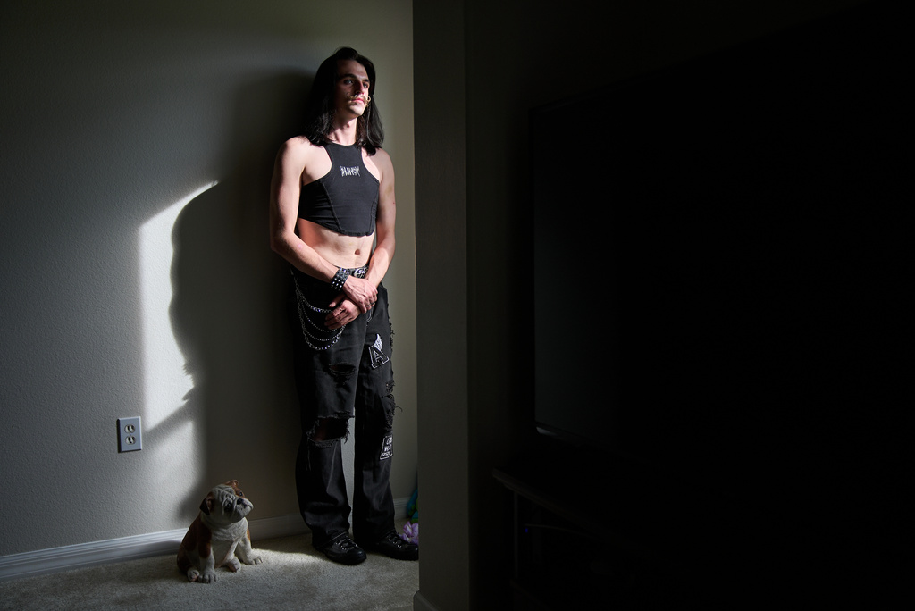 Elijah Button, 21, poses for a portrait in St. Cloud, Fla., Thursday, Aug. 13, 2026. (AP Photo/Jacquelyn Martin)