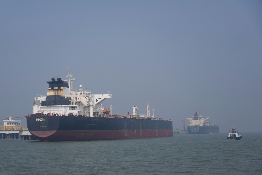Liberia-flagged tanker Shenlong Suezmax, carrying crude oil from Saudi Arabia, that arrived clearing the Strait of Hormuz, is seen at the Mumbai Port in Mumbai, India, Thursday, March 12, 2026. (AP Photo/Rafiq Maqbool)