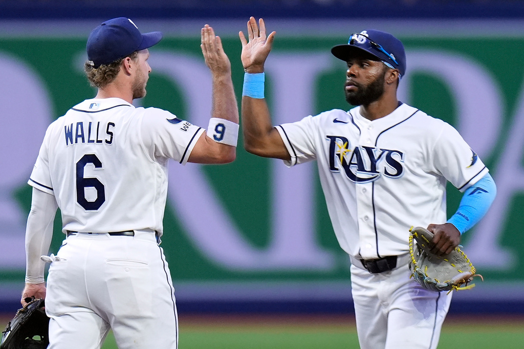 Tampa Bay Rays shortstop Taylor Walls (6) and center fielder Cedric Mullins celebrate after the team defeated the Boston Red Sox during a baseball game Tuesday, June 9, 2026, in St. Petersburg, Fla. (AP Photo/Chris O'Meara)