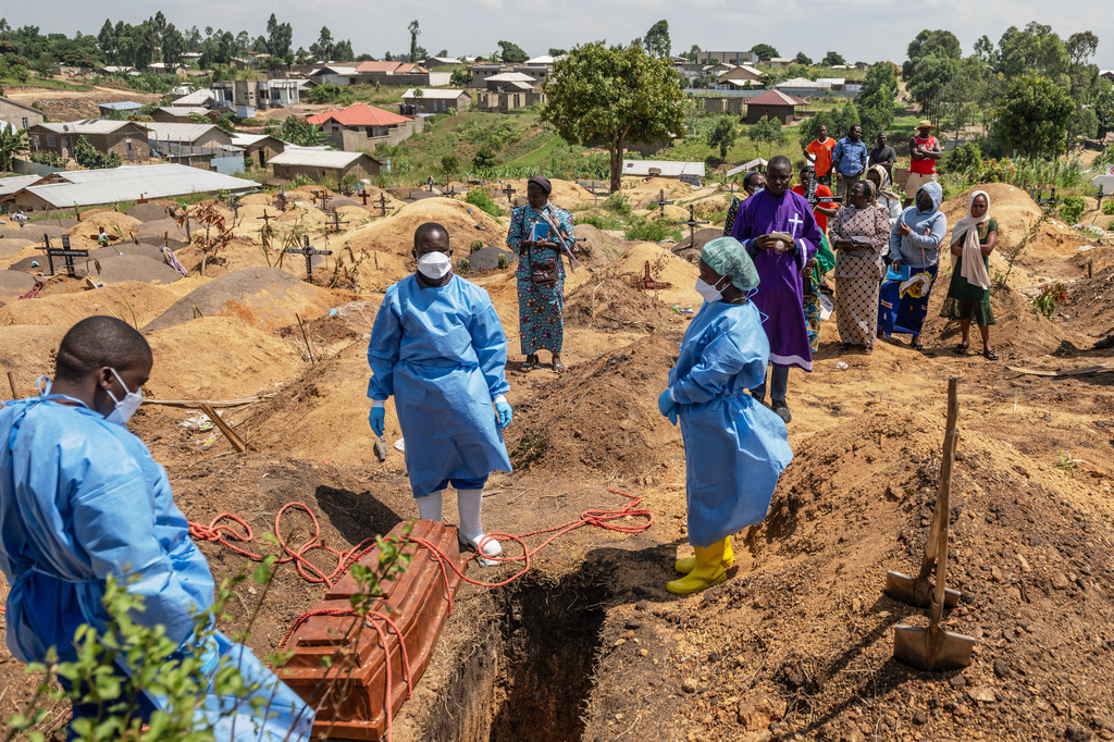 Red Cross workers prepare to bury Vanisa Anifa, a 6-month-old orphaned girl who died of Ebola, at the Bigo Cemetery, in Bunia, Congo, Friday, June 19, 2026. (AP Photo/Moses Sawasawa)