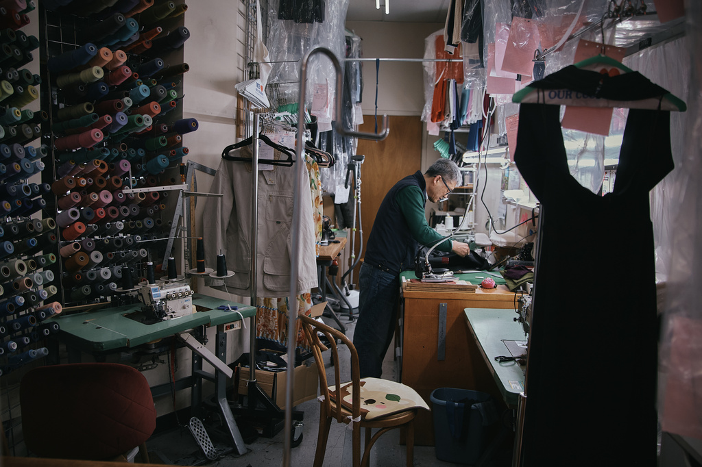 Tailor, Kil Bae, works inside his shop on Friday, March 27, 2026, in New York. (AP Photo/Andres Kudacki)